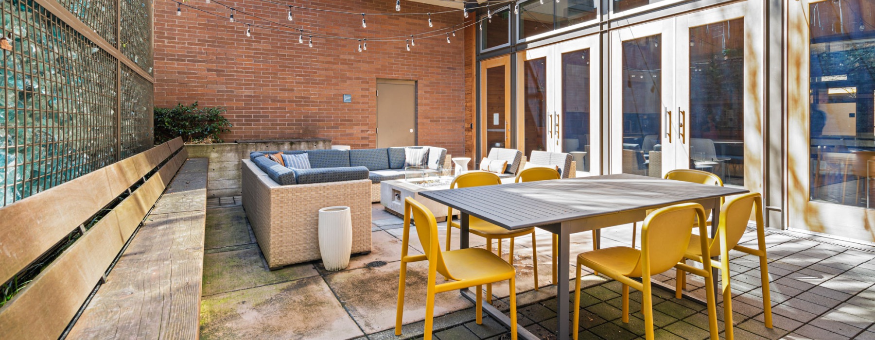 a patio with a table and chairs