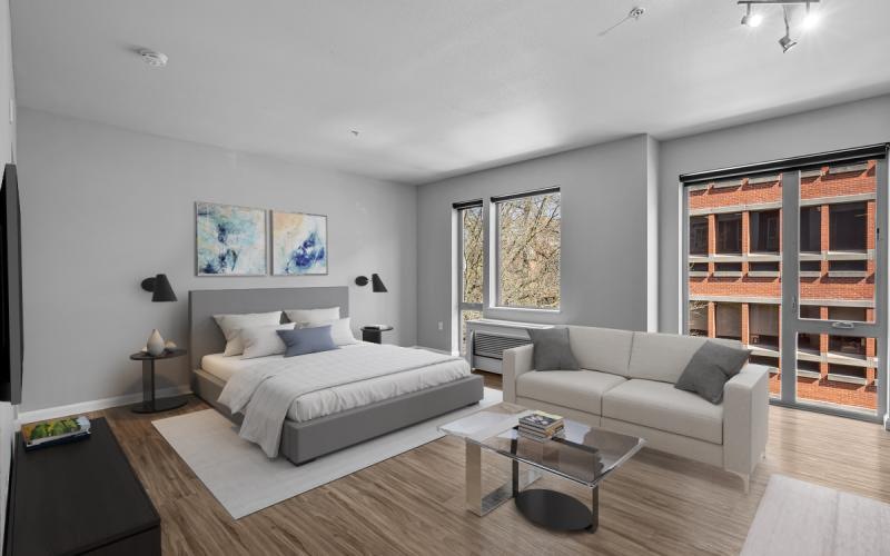 a bedroom with a large bed and a couch